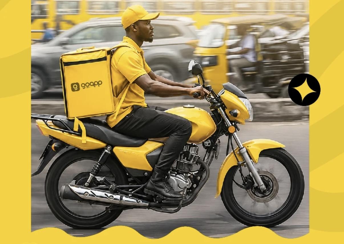 GoCaby rider on a yellow motorcycle delivering a package in Nigeria